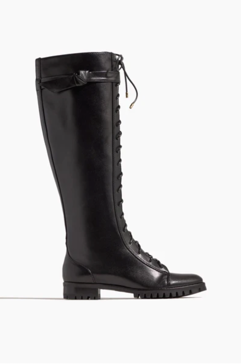 pair of lace up knee high black boots used in a personal style guide