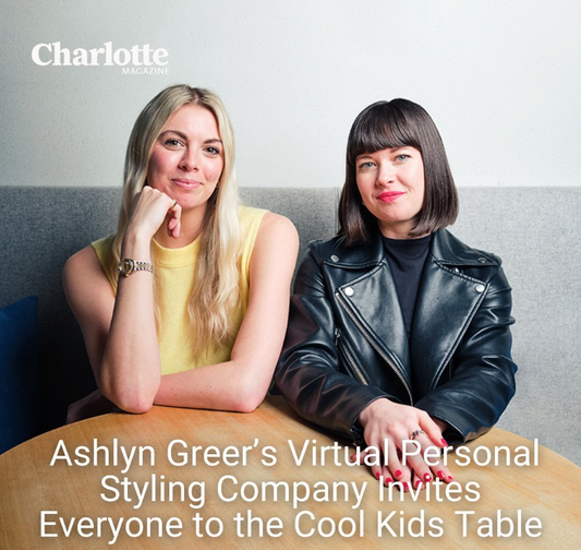 Photo for Charlotte Magazine of two women sitting at a table smiling. One is wearing a yellow tank top and the other is wearing a black leather jacket. The article title "Ashlyn Greer's virtual personal styling company invites everyone to the cool kids table" is underneath the women 